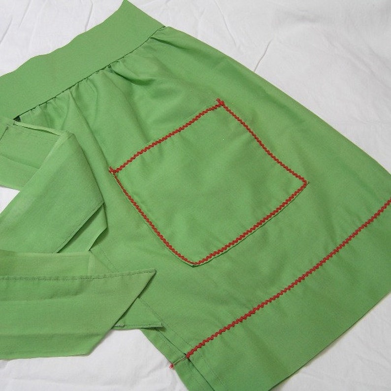 1 Pocket Poly Cotton Blend Kitchen Decor 1980s Apron in Green Christmas Holiday Print with Red Rick Rack Trim Bright Colors Bells