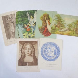 7 biglietti e souvenir a tema religioso: Angelo e bambini, Pastore con pecore, Madonna in croce, Notre Dame, altro, carta riciclata
