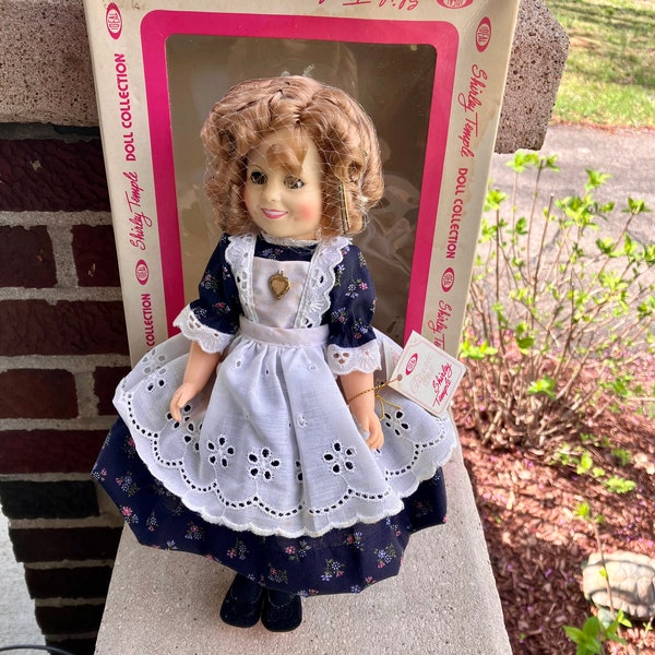 1982 Shirley Temple 12 Inch Doll with Box by Ideals, Calico Dress, Heart Pendant, 2 Layer Slip, Black Shoes & Socks, Hair Net, Tag,