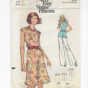 May include: Vintage Vogue Patterns sewing pattern. The pattern features a dress with a geometric print, a red belt, and a V-neck. The illustration also shows a blue top with white pants. The text on the pattern reads "Very Easy Vogue Patterns".