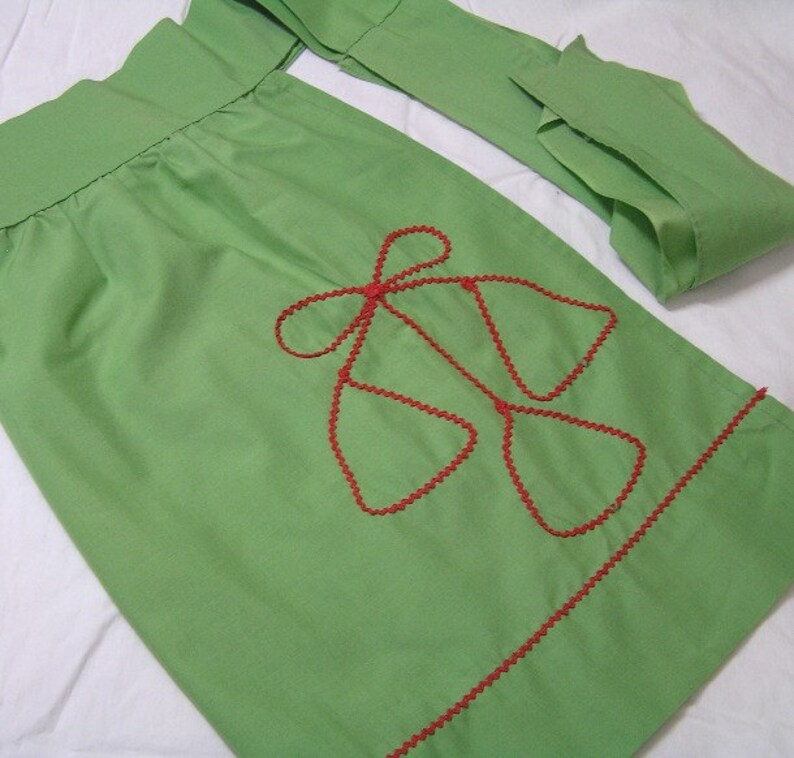 1 Pocket Poly Cotton Blend Kitchen Decor 1980s Apron in Green Christmas Holiday Print with Red Rick Rack Trim Bright Colors Bells