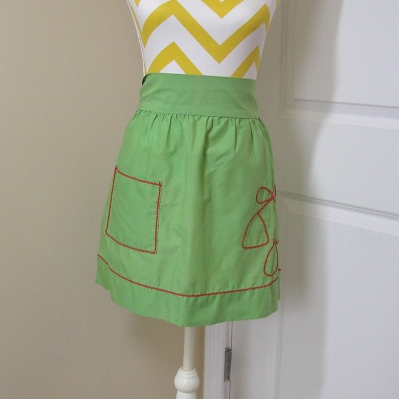 1 Pocket Poly Cotton Blend Kitchen Decor 1980s Apron in Green Christmas Holiday Print with Red Rick Rack Trim Bright Colors Bells