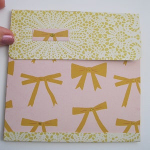 May include: A set of three ceramic mugs with a speckled, matte finish. The mugs are in shades of cream, light gray, and dark gray. Each mug has a simple, minimalist design, perfect for coffee or tea.