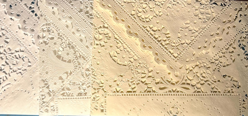 To the left is the original bright white - all out. The center is the new batch of 20 year-old vintage doilies which are a warm white. On the right is a rich cream in the same style.
