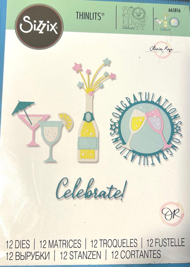 May include: A Sizzix Thinlits die set featuring 12 metal cutting dies for paper crafting. The package displays illustrations of a champagne bottle with stars, two cocktail glasses, and a circular design with two glasses and the text CONGRATULATIONS.
