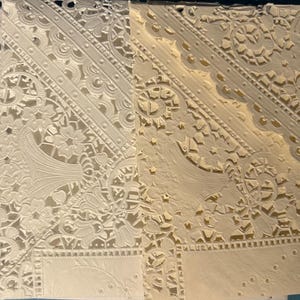 Tothe far left is the most stark white of these doilies. The middle one is the new batch of doilies which are vintage and 20 years old and are a warm white. They are all that is available now. This one on the right is a rich cream in this same style.