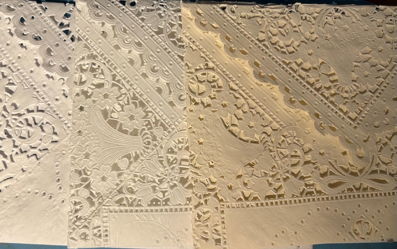 Tothe far left is the most stark white of these doilies. The middle one is the new batch of doilies which are vintage and 20 years old and are a warm white. They are all that is available now. This one on the right is a rich cream in this same style.