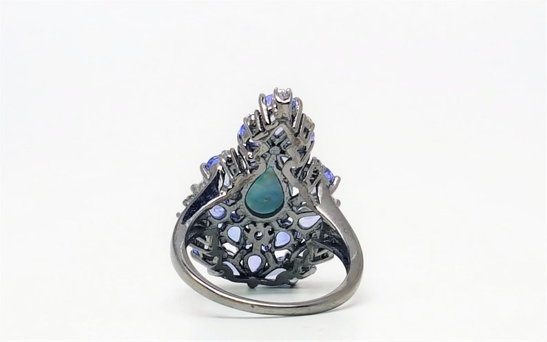 4.50ct Pear Shaped Tanzanite and 9x6mm Larimar Black Rhodium over Sterling Silver Ring