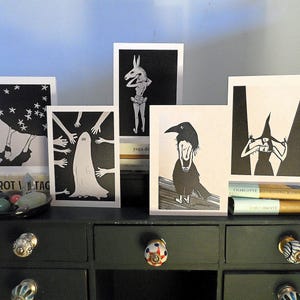 Cartões de felicitações - pacote com cinco cartões em branco - diversos designs de cabeças de coque - peculiares - corvo, bruxa, estrelas, fantasma