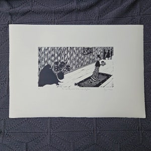 May include: Black and white woodcut print of a woman standing on a rug in a room with patterned wallpaper. The woman is holding a small object in her hand. The text "The empty word it the repeating game" is printed below the image.