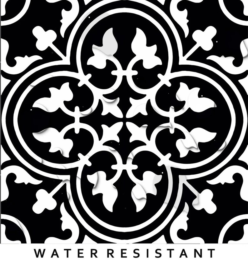 May include: A square tile featuring a high-contrast black and white pattern with symmetrical floral and quatrefoil motifs. The design includes interconnected curved lines and leaf-like shapes. The text WATER RESISTANT is printed in black below.