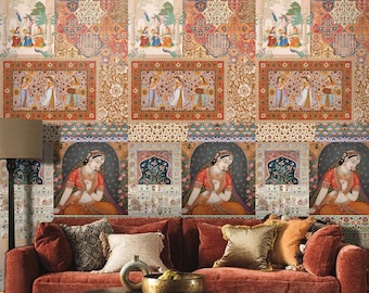 May include: A red velvet sofa with pillows in front of a wall covered in a colorful patterned wallpaper featuring intricate designs and figures. The wallpaper has a patchwork style with different patterns and colors. A round metal coffee table with a hammered finish sits in front of the sofa.