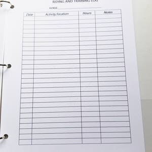 May include: A blank white log book with the title "Riding and Training Log" and columns for "Date", "Activity/Location", "Hours", and "Notes".