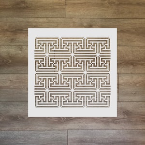 May include: White stencil with a geometric pattern of squares and rectangles. The pattern is repeated throughout the stencil.