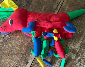 Happy Dog Nursing Three Puppies