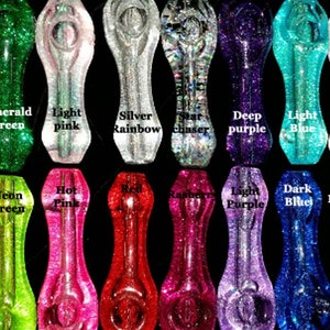 May include: A collection of 18 glass pipes with various glitter colors, including neon yellow, emerald green, light pink, silver rainbow, star chaser, deep purple, light blue, rainbow white, neon orange, neon green, hot pink, red, raspberry, light purple, dark blue, and black rainbow.