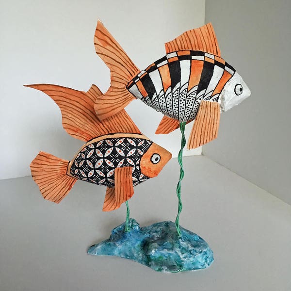 Paper mache fish sculpture with southwestern design.