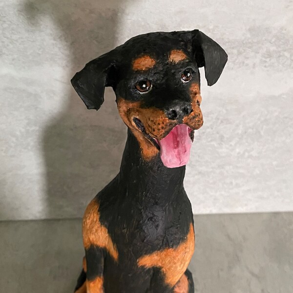 Rottweiler sculpture made from beer bottle and paper mache