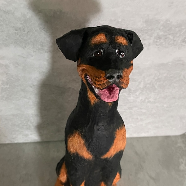 Rottweiler sculpture made from beer bottle and paper mache