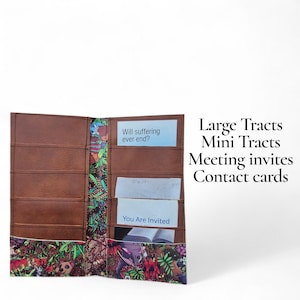 May include: Open brown leather wallet with multiple pockets, featuring colorful floral and animal print accents. The wallet holds cards with text: "Will suffering ever end?" and "You Are Invited." Text on the side reads: "Large Tracts, Mini Tracts, Meeting invites, Contact cards."