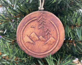 Mountains and trees ornament