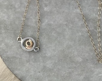 Rosa mini necklace 14k gold cable chain and focal point of solid yellow gold abstract rose center of silver metal circle boarder 16” length