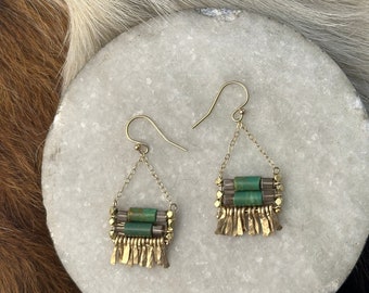 The natural turquoise and smokey quartz "Carmine" earring has irregular length handforged gold fringe, gold chain and gold  earwire