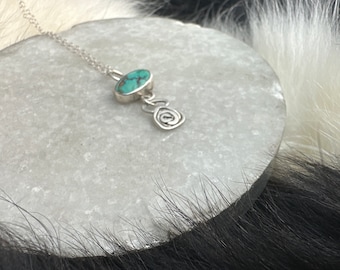 Rosa necklace pendant made of high quality oval shaped turquoise stone and and Sterling silver metal and delicate chain