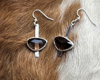 The “Dana” earring, each is 6 carates of smokey grey quartz stone set on a strip of sterling silver fringe