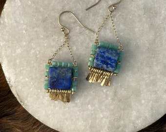 The "Carmine" earring: blue lapis, teal glass cube beads and gold chain with hand forged gold fringe