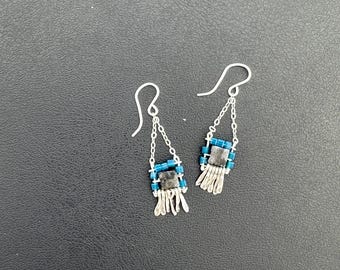 The "Carmine" earring: hammered silver fringe, black and grey labradorite stone, denim blue cube glass beads, silver chain and ear wires