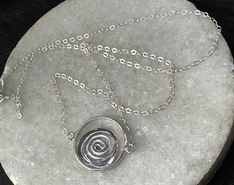 Rosa necklace round sterling silver circle with sterling silver metal abstract rose in the center on delicate cable chain 18” length