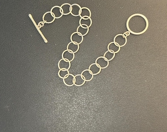 Alicia bracelet 7 1/4 inch length, 3/8 inch circle link handmade sterling silver metal with toggle clasp closure