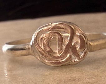 Handmade ring, comfort band, oval shape with abstract rose in sterling silver