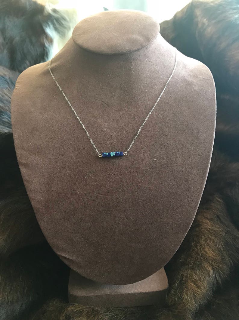 The Candace necklace is delicate and short made of silver chain necklace with five 3mm sized cube recon azurite beads 18 inch length chain