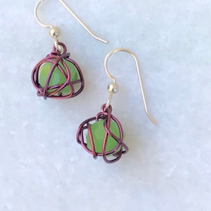 Leesa earring: bright green glass bead with purple colored wire and sterling silver earwire image 1