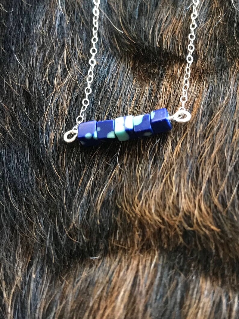 The Candace necklace is delicate and short made of silver chain necklace with five 3mm sized cube recon azurite beads 18 inch length chain
