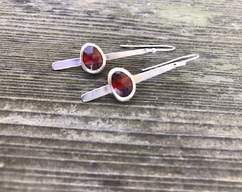 Garnet "Dana” earring,  two 10mm rose cut garnet stones set on a strip of sterling silver fringe handset and handcut silver earring