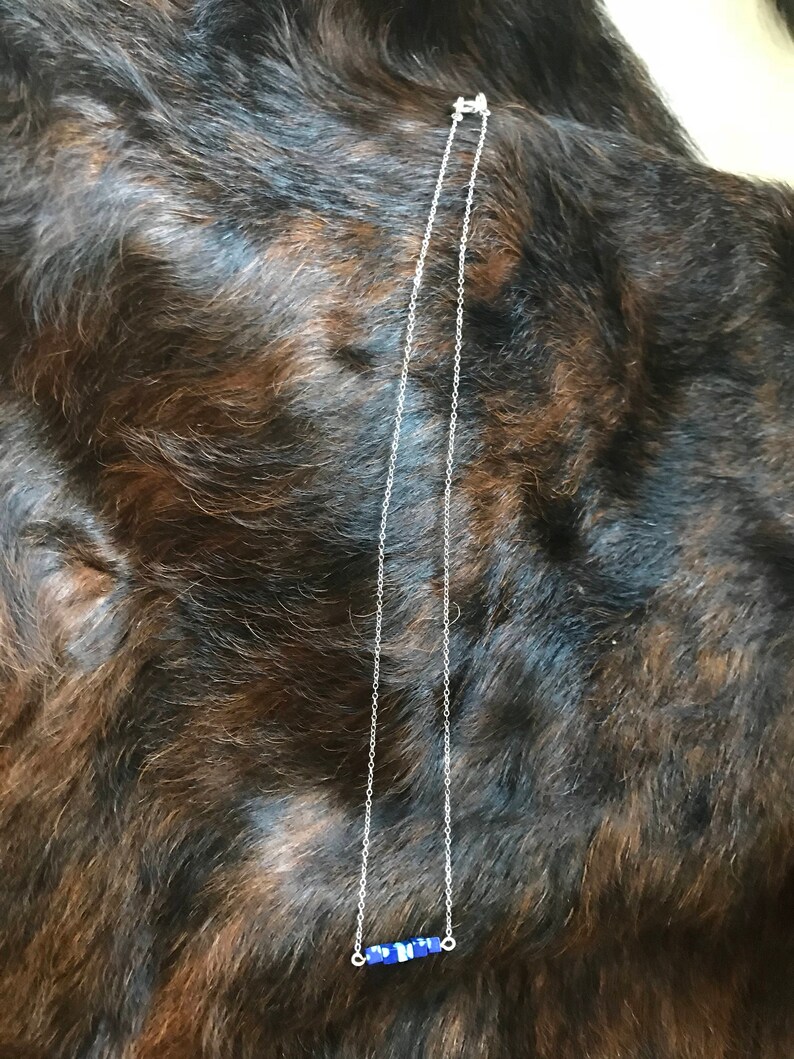 The Candace necklace is delicate and short made of silver chain necklace with five 3mm sized cube recon azurite beads 18 inch length chain