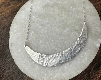 The Jodi necklace, hammered texture and made of fine sliver by hand with a sterling silver chain