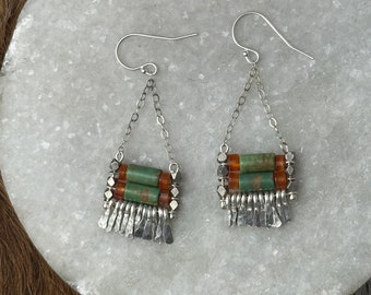 The turquoise and orange carnelian bead "Carmine" earring has hand forged silver fringe with silver chain and silver fishhook