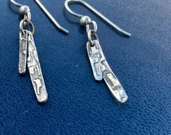 The "Margot" earring: two different lengths of textured silver bars with a bit of patina for antiquing effect