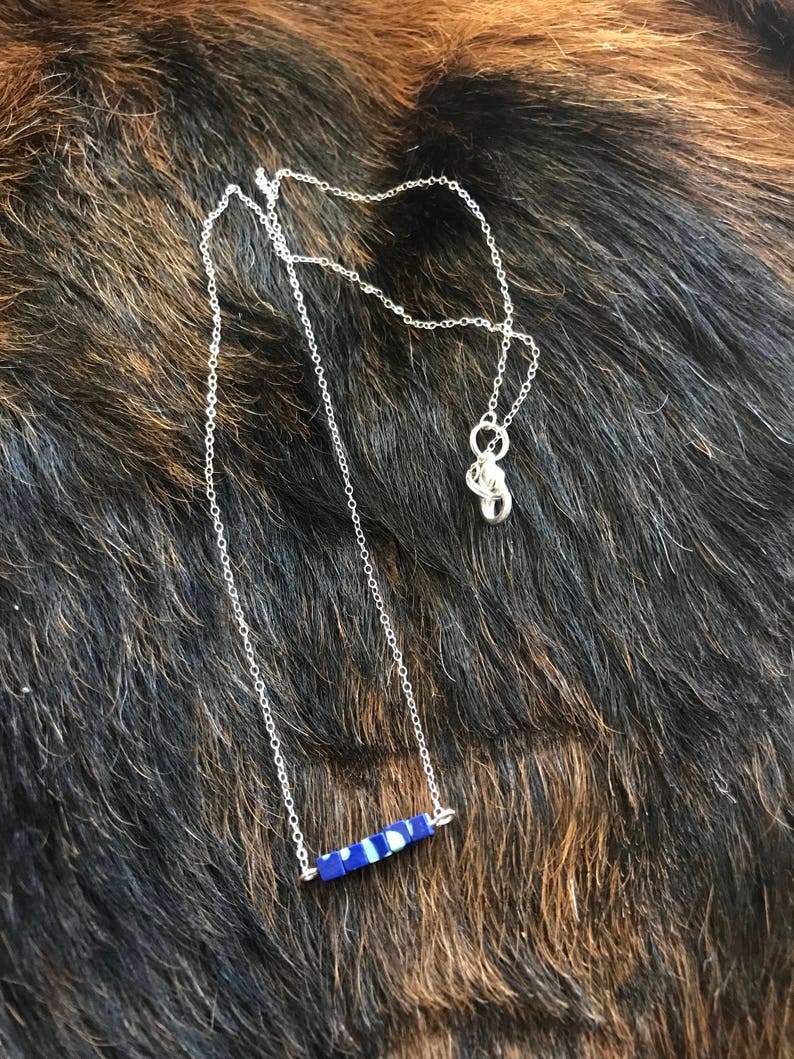 The Candace necklace is delicate and short made of silver chain necklace with five 3mm sized cube recon azurite beads 18 inch length chain