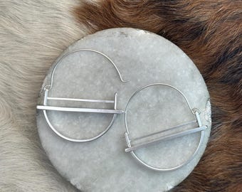 The "kandy" earring is three layers of silver structured and rounded large version