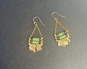 The natural turquoise and smokey quartz "Carmine" earring has irregular length handforged gold fringe, gold chain and gold  earwire