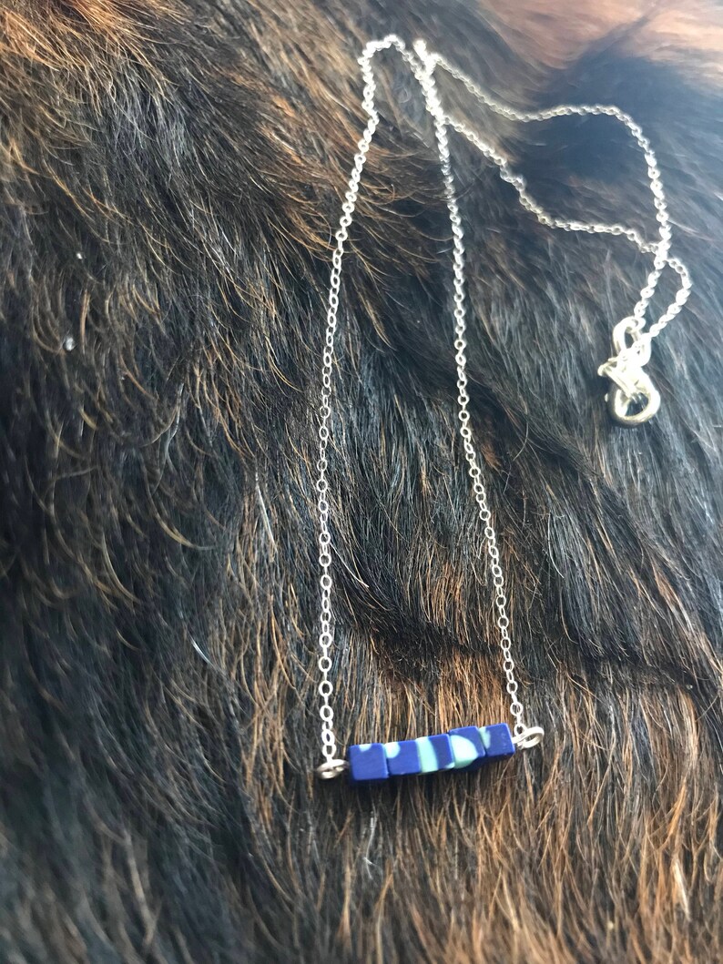 The Candace necklace is delicate and short made of silver chain necklace with five 3mm sized cube recon azurite beads 18 inch length chain