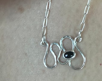 Marlee necklace a sterling silver necklace with black onyx stone set on a squiggle design