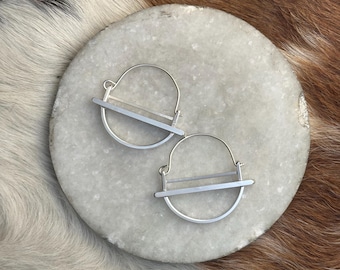 The medium "kandy" earring is three layers of brushed silver structured and rounded