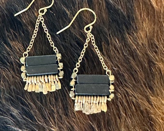 The blackstone and brass faceted bead "Carmine" earring has handforged gold-fill wire fringe, gold chain and gold earwire