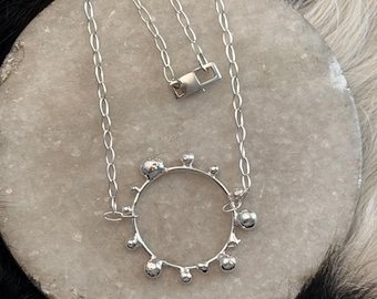 Sculpted bubble and ball accented circle necklace on 18 inch chain